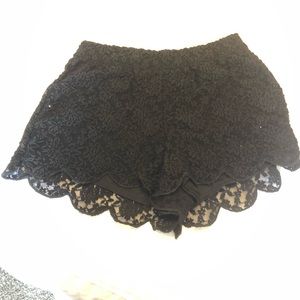 Free People Black lace shorts.
